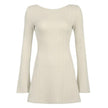 White backless mini dress by FJØRNA, stylish and fitted, shown from the back with a sleek, minimalist design.