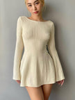 White backless mini dress by FJØRNA featuring a sleek, fitted design perfect for stylish occasions.