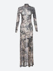 White Baddie Tattoo Maxi Dress by FJØRNA, featuring a fitted silhouette and stylish tattoo-inspired print, worn by a model.