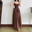 FJØRNA women's basque waist dress in mini, midi, or maxi length, with fitted bodice and flowing skirt, showcased on a model.