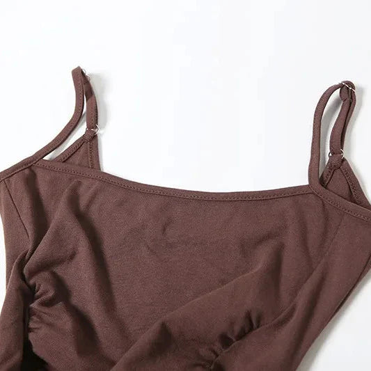 FJØRNA women's basque waist dress, available in mini, midi, and maxi lengths, featuring a fitted bodice and elegant silhouette.