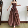 FJØRNA women's Basque waist dress in mini, midi, and maxi styles, featuring fitted bodice and flowing skirt in elegant fabric.