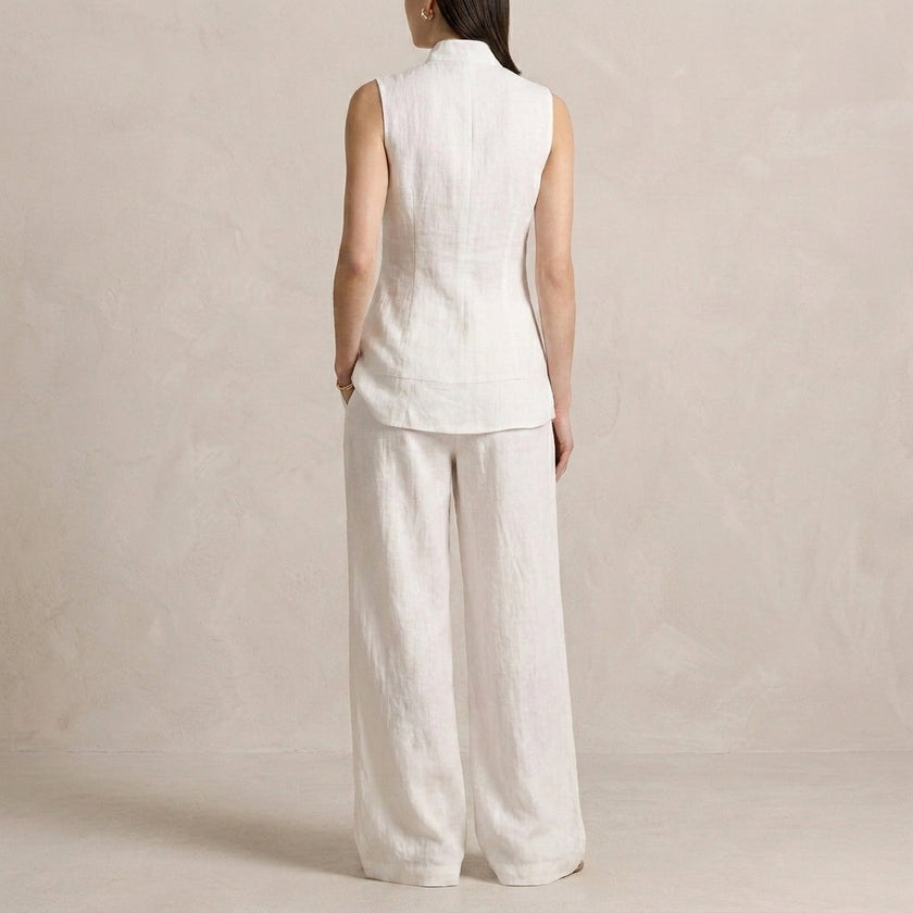 FJØRNA sophisticated sleeveless high-neck two-piece set with flowing wide-leg trousers, shown from the back.