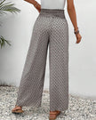 Beige lightweight summer trousers for women by FJØRNA, wide leg, breathable, flowy fabric for a comfortable casual look