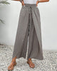 Beige lightweight summer women's trousers by FJØRNA, wide-leg breathable flowy pants with relaxed fit.