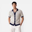 Men's lightweight striped knit polo shirt in beige and blue, classic fit from FJØRNA, suitable for summer wear.