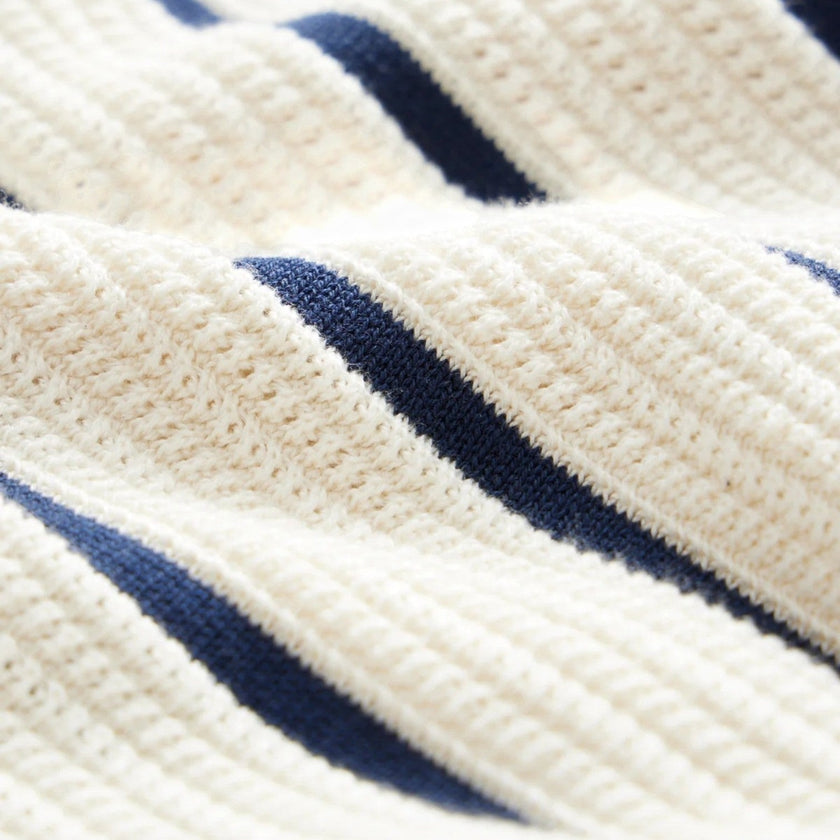 Men's striped knit polo shirt by FJØRNA featuring beige and blue lightweight summer fabric and classic fit style.