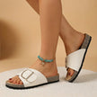 FJØRNA orthopedic cork slide sandals in beige with adjustable buckle and open toe, showcasing comfortable footbed and stylish design.