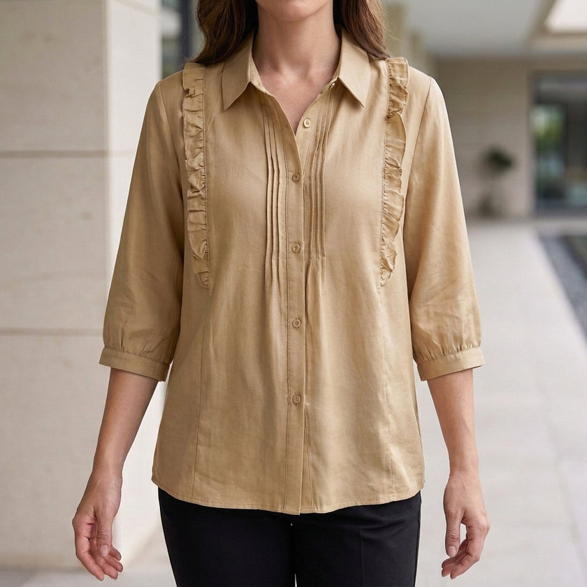 Beige summer blouse for women by FJØRNA featuring denim fabric and ruffle details, perfect for warm-weather styling.