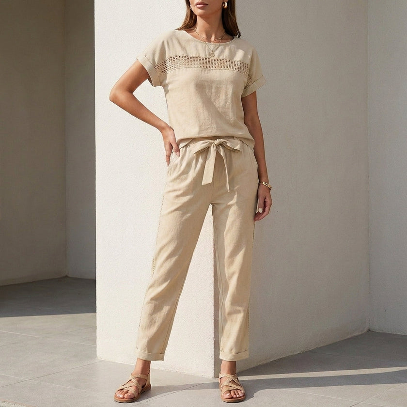 Beige FJØRNA women's two-piece co-ord set with mesh pockets, featuring a stylish top and matching pants for casual wear.