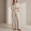 Beige women's summer two-piece co-ord set with wide-leg pants and matching top by FJØRNA.