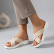 Beige women's orthopedic sandals by FJØRNA with adjustable straps and criss-cross design, showing the comfortable sole and open toe style.