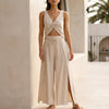 Beige women's summer two-piece set by FJØRNA featuring a ruched V-neck top and matching shorts.