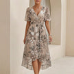 Beige FJØRNA Sofia Amoretti flowing chiffon wrap midi dress with tie waist, elegant and lightweight for special occasions.
