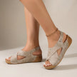 Beige FJØRNA orthopedic criss-cross slingback wedge sandals for women with supportive straps and a comfortable wedge heel.