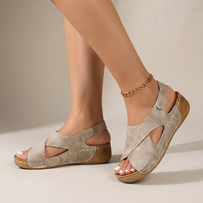 Beige FJØRNA orthopedic criss-cross slingback wedge sandals for women with supportive straps and a comfortable wedge heel.