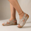 Beige FJØRNA orthopedic criss-cross slingback wedge sandals for women with supportive straps and a comfortable wedge heel.