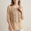 Beige floral V-neck summer blouse for women by FJØRNA, featuring lightweight fabric and feminine design.