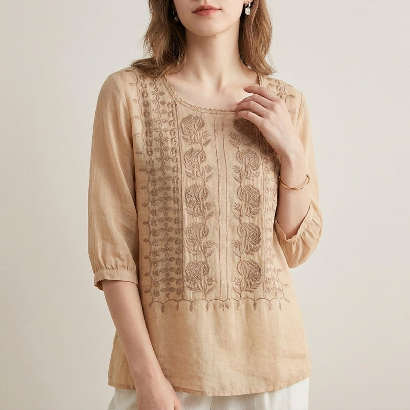 Beige floral V-neck summer blouse for women by FJØRNA, featuring lightweight fabric and feminine design.