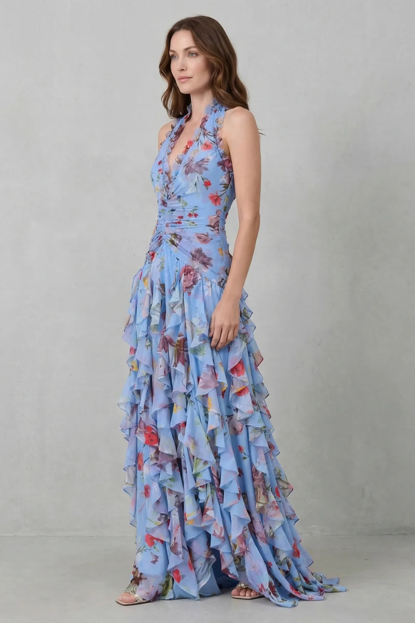 FJØRNA elegant floral maxi dress for women with halter neck and flowy silhouette, featuring romantic cascade design.