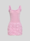 FJØRNA Bimbocore women's mini dress, stylish party and day wear dress with a modern design, shown hanging on a wooden hanger.