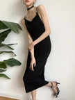 Black butterfly back midi dress by FJØRNA featuring a fitted silhouette and elegant back design, perfect for stylish occasions.