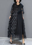 FJØRNA black tulle party dress with o-neck, asymmetrical hem, and half sleeves, perfect for evening events.