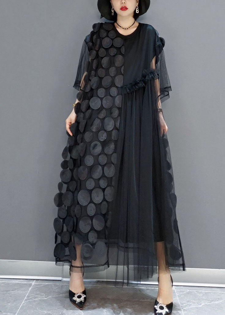 FJØRNA black tulle party dress with o-neck, asymmetrical hem, and half sleeves, perfect for evening events.