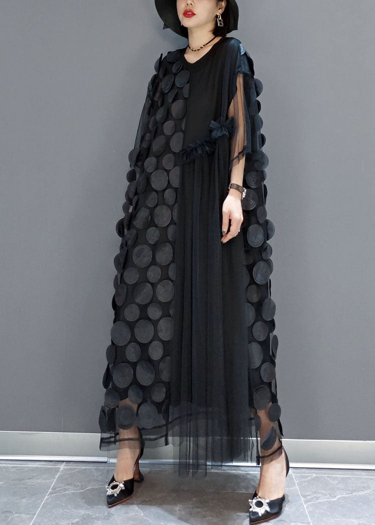 FJØRNA black tulle party dress with o-neck, asymmetrical hem, and half sleeves, perfect for evening occasions.