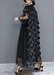 FJØRNA black tulle party dress with o-neck, asymmetrical hem, half sleeves, suitable for evening events.