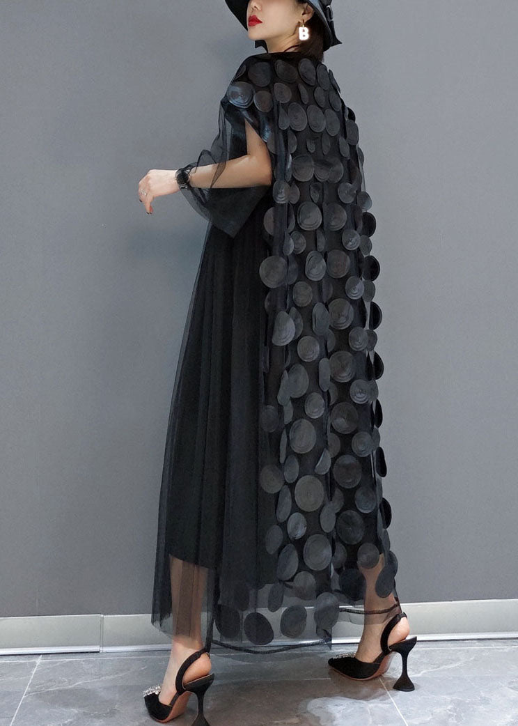 FJØRNA black tulle party dress with o-neck, asymmetrical hem, half sleeves, suitable for evening events.