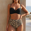 FJØRNA fitted wrap bikini set for women in black leopard print, featuring a stylish bikini top and matching bottoms.