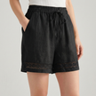 Black FJØRNA mini dress for women with drawstring linen fabric, featuring a stylish, elegant design perfect for casual or dressy occasions.