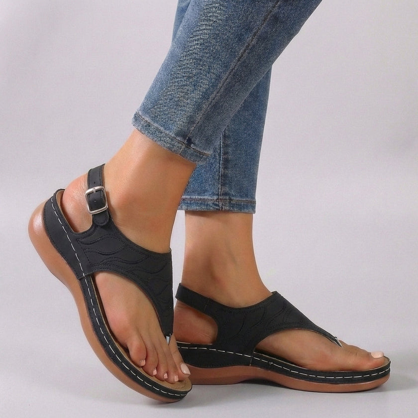 Black FJØRNA orthopedic embroidered wedge heel sandals with ankle strap and open toe, featuring detailed embroidery and supportive design.
