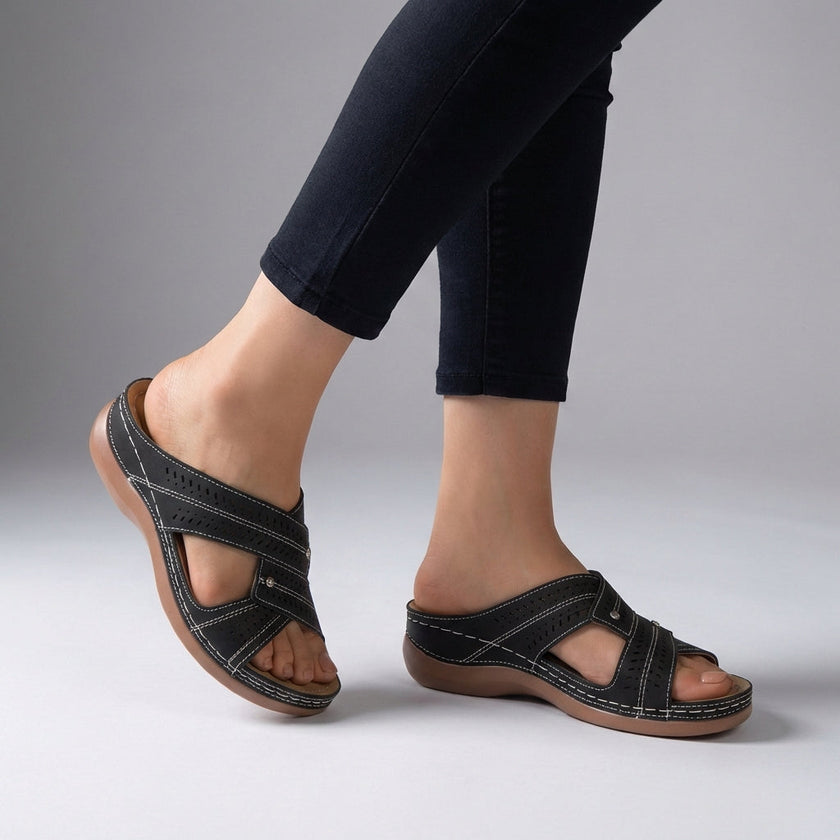 Black FJØRNA orthopedic open toe wedge sandals with T-strap and rhinestone accents, showcasing a stylish and supportive footwear design.