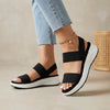 Black FJØRNA women's orthopedic sandals with adjustable straps and flowy design, showcasing comfortable, supportive footwear for women.