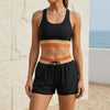 Black women's summer two-piece co-ord set with pockets, featuring a matching top and pants from FJØRNA.
