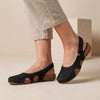 Black FJØRNA orthopedic closed-toe slingback sandals for women, featuring supportive design and comfortable fit.