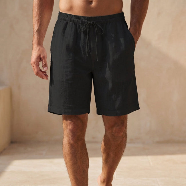 FJØRNA men's black quick-dry above-the-knee swim shorts with relaxed fit and drawstring waist, perfect for beach or pool.