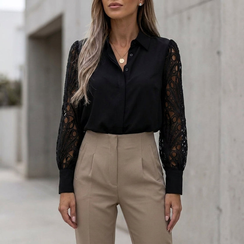 Black summer blouse for women by FJØRNA featuring geometric V-neck lace design and lightweight fabric.