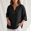 Black V-neck linen blouse for women by FJØRNA, button-front summer top with a relaxed fit and stylish design.