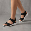 Black women's orthopedic sandals with adjustable straps and linen details, designed for comfort and support by FJØRNA.