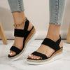 Black FJØRNA women's orthopedic espadrilles with adjustable strap and arch support, designed for comfortable walking.