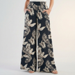 Black women’s summer trousers by FJØRNA featuring cotton fabric and ruched details for a stylish, comfortable look.