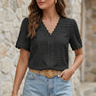 Black FJØRNA women's summer blouse with V-neck, short sleeves, and flowy linen fabric, perfect for warm weather.
