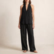 Black FJØRNA relaxed two-piece halter V-neck set with wide-leg pants, featuring a stylish and comfortable coordinated outfit.