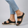 Black FJØRNA women's orthopedic heeled sandals with wedge heel and adjustable strap, stylish and supportive footwear.