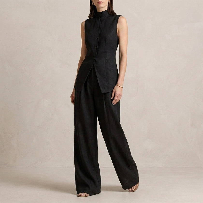 Black FJØRNA sleeveless high-neck two-piece set with flowing wide-leg trousers, stylish and elegant for sophisticated looks.