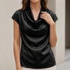 Black satin summer blouse for women with a cowl neck and short sleeves, styled by FJØRNA.