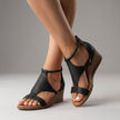 Black FJØRNA orthopedic T-strap wedge sandals for women with supportive straps and comfortable wedge heel.